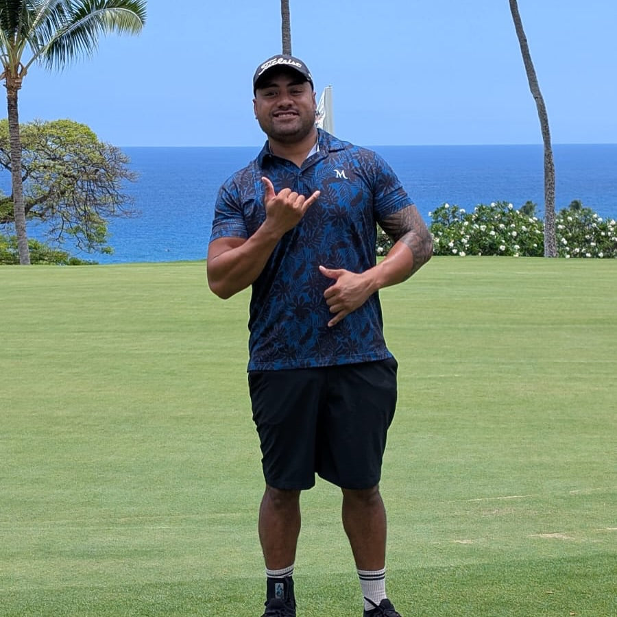 Island Nights Polo shirt, black with subtle Polynesian patterns, designed for golfers. Proudly designed in New Zealand.