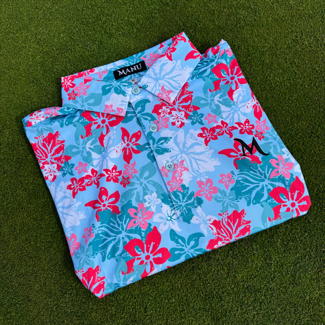 Island Bloom Polo shirt in light blue, featuring Polynesian-inspired patterns for a stylish golf look. Proudly designed in New Zealand.