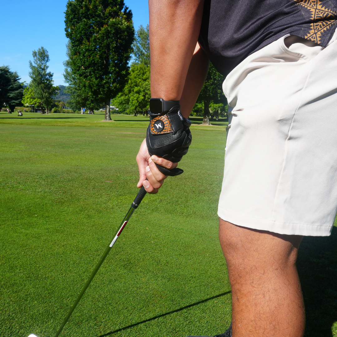 Golfer wearing Black Manu Golf glove, designed for optimal grip and comfort during play. Proudly designed in New Zealand.