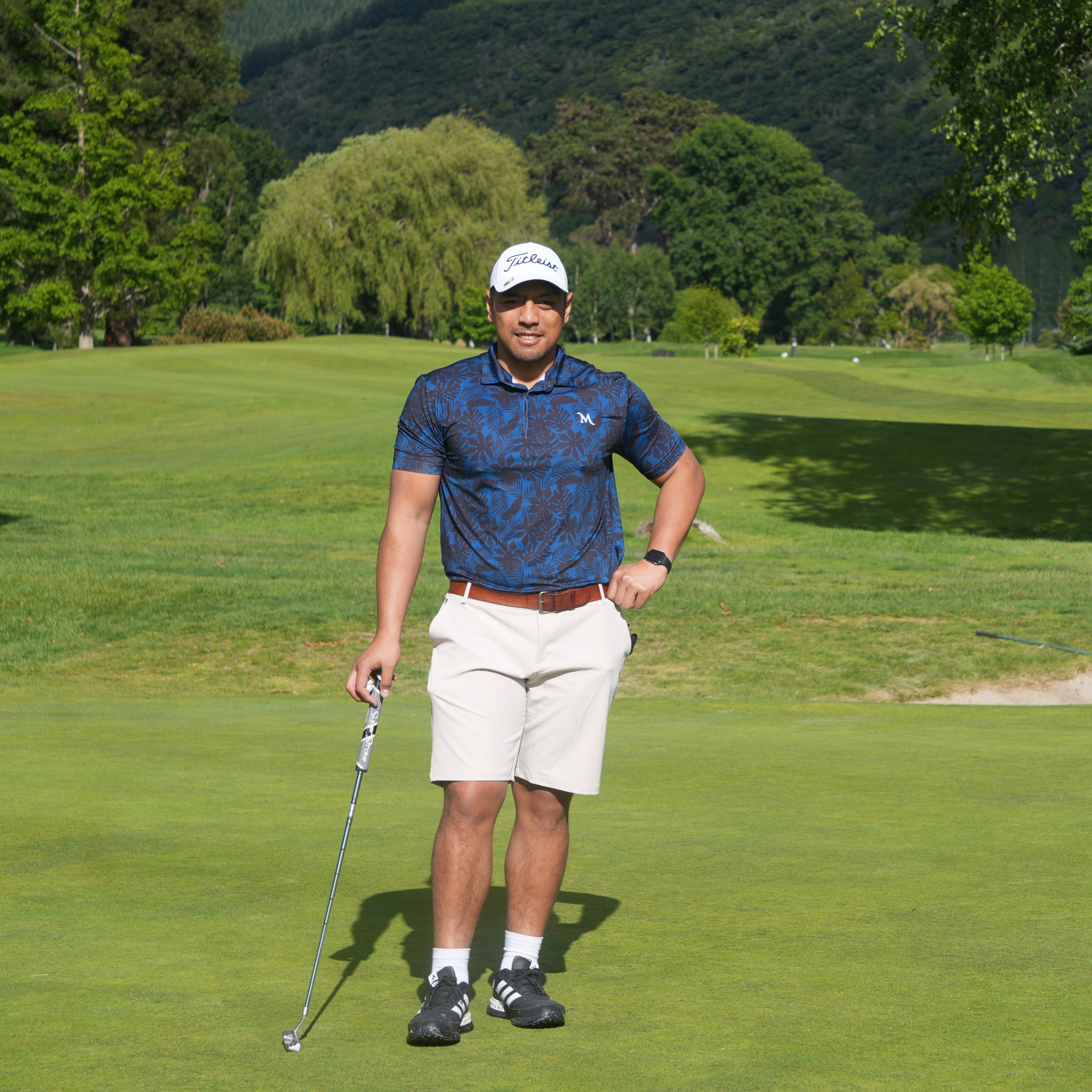 Island Nights Polo shirt, black with subtle Polynesian patterns, designed for golfers. Proudly designed in New Zealand.