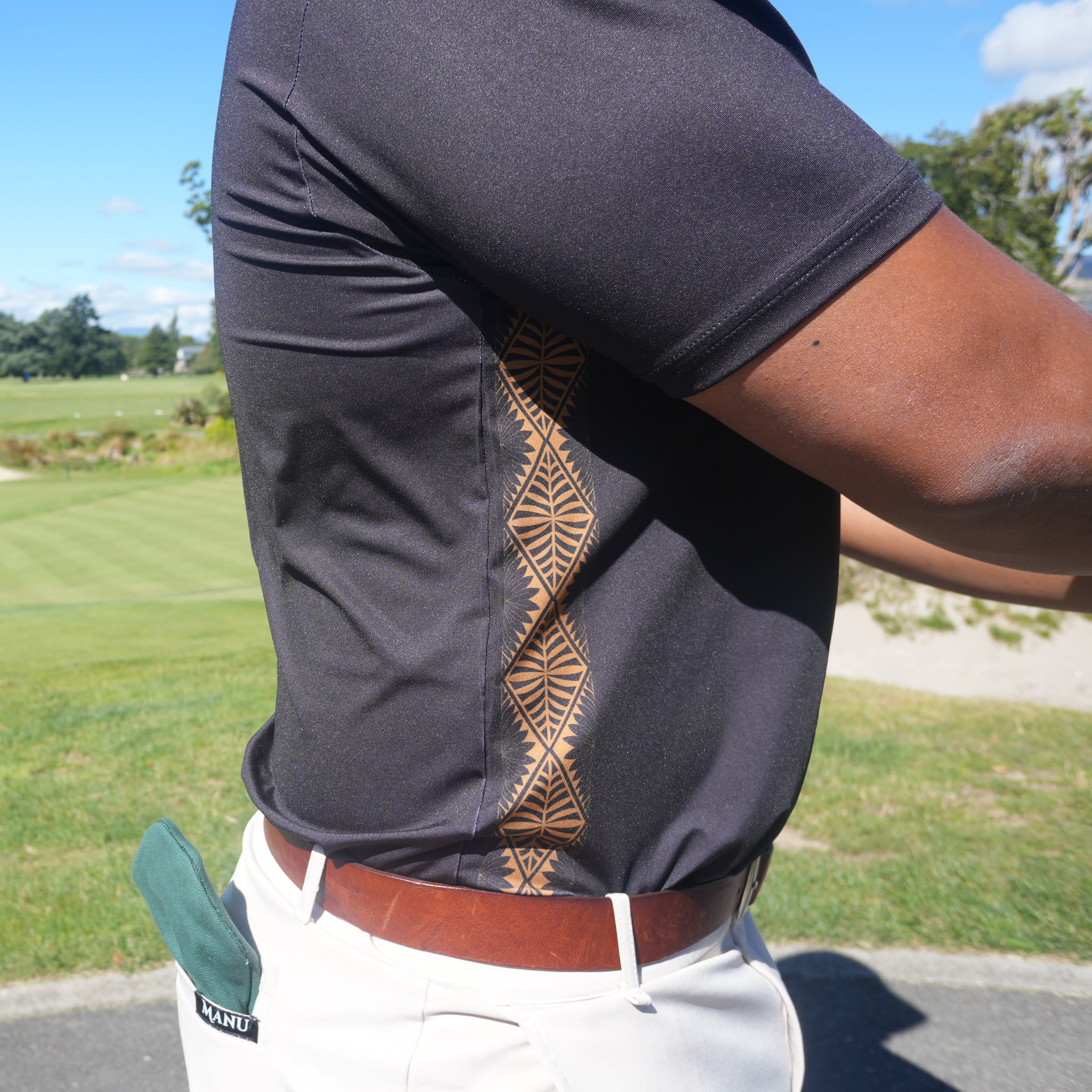 Heritage Golf Polo showcasing classic Polynesian pattern, designed for stylish comfort and performance on the golf course.