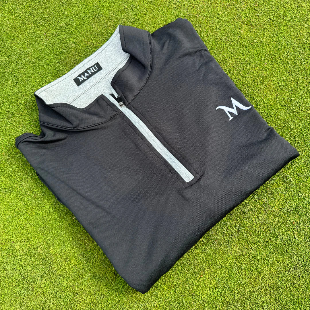 Close-up of the 1/4 zip pullover fabric, showing the texture and comfort features. Proudly designed in New Zealand.