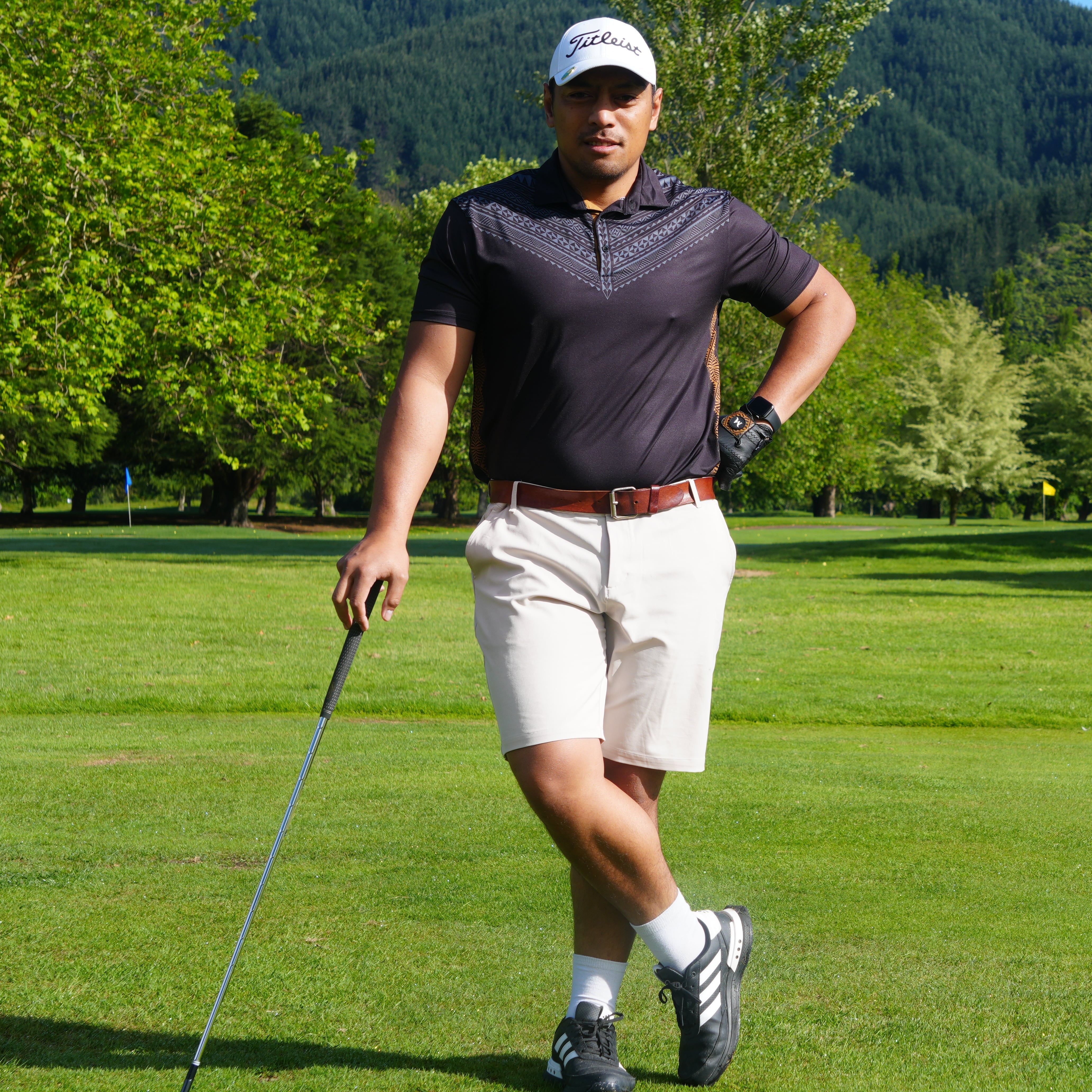 Model wearing the Heritage Polo shirt on the golf course, combining heritage design with modern performance. Proudly designed in New Zealand.