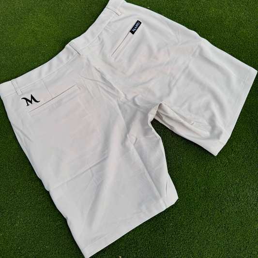 Close-up of the Crème Manu Shorts fabric, showcasing its lightweight and breathable material and the Manu logos. Proudly designed in New Zealand.