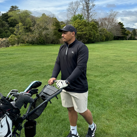 Black 1/4 zip pullover for golf, designed for warmth and versatility on and off the course. Proudly designed in New Zealand