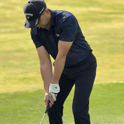 Model wearing the Island Nights Polo shirt on the golf course, showcasing its comfortable fit and design. Proudly designed in New Zealand.